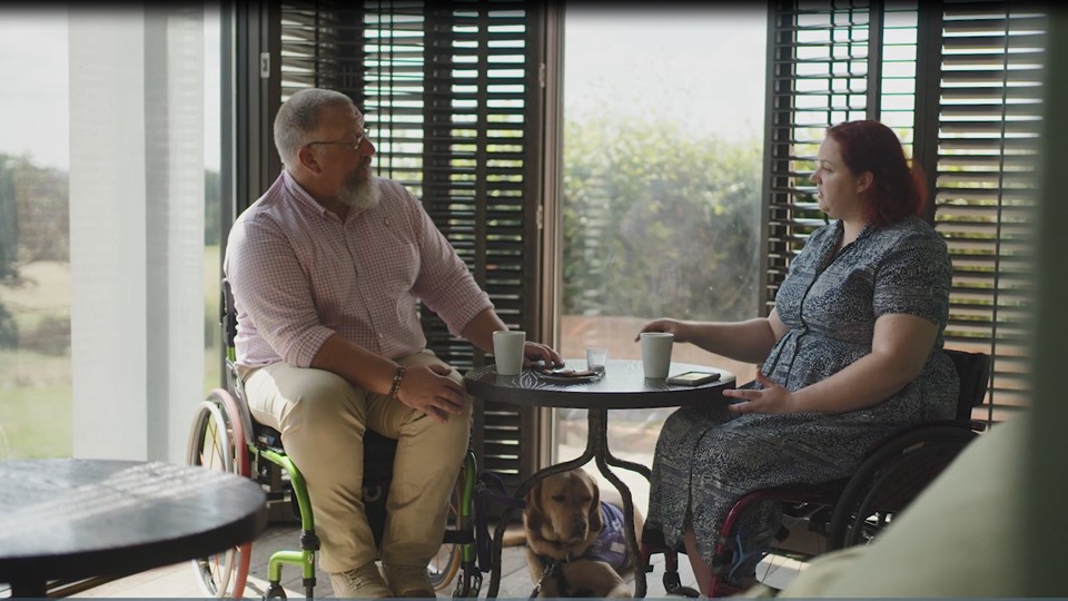 Veterans in civilian clothes at a table having a chat