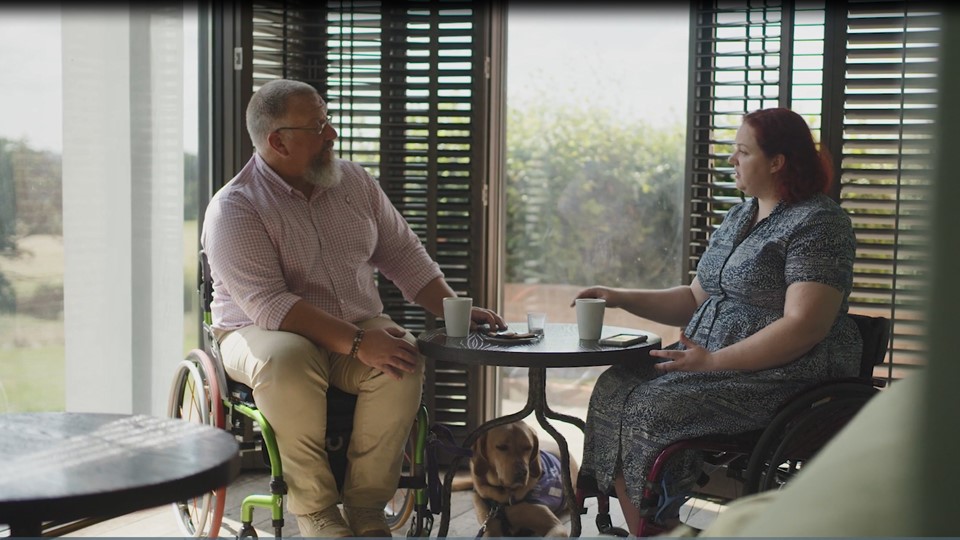 Veterans in civilian clothes at a table having a chat 