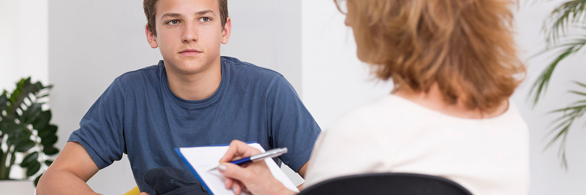 Teenage boy meeting with CYPF staff member