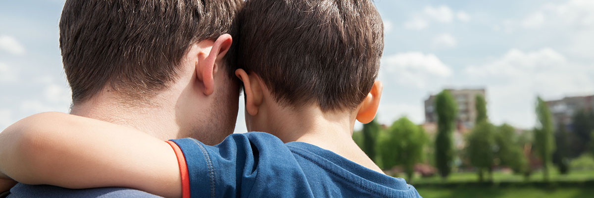 Father and son hugging