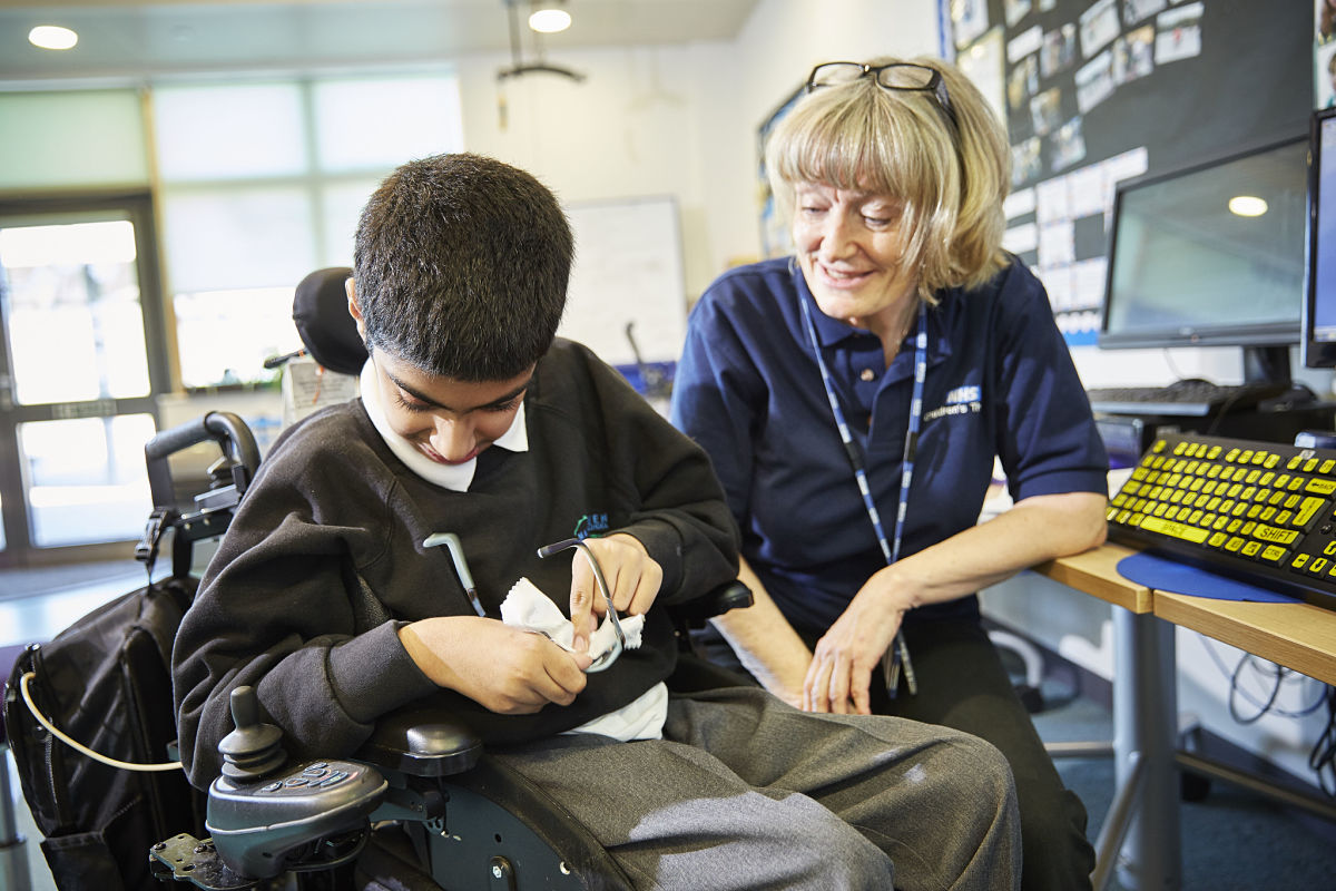Male student with specialist mobility equiptment