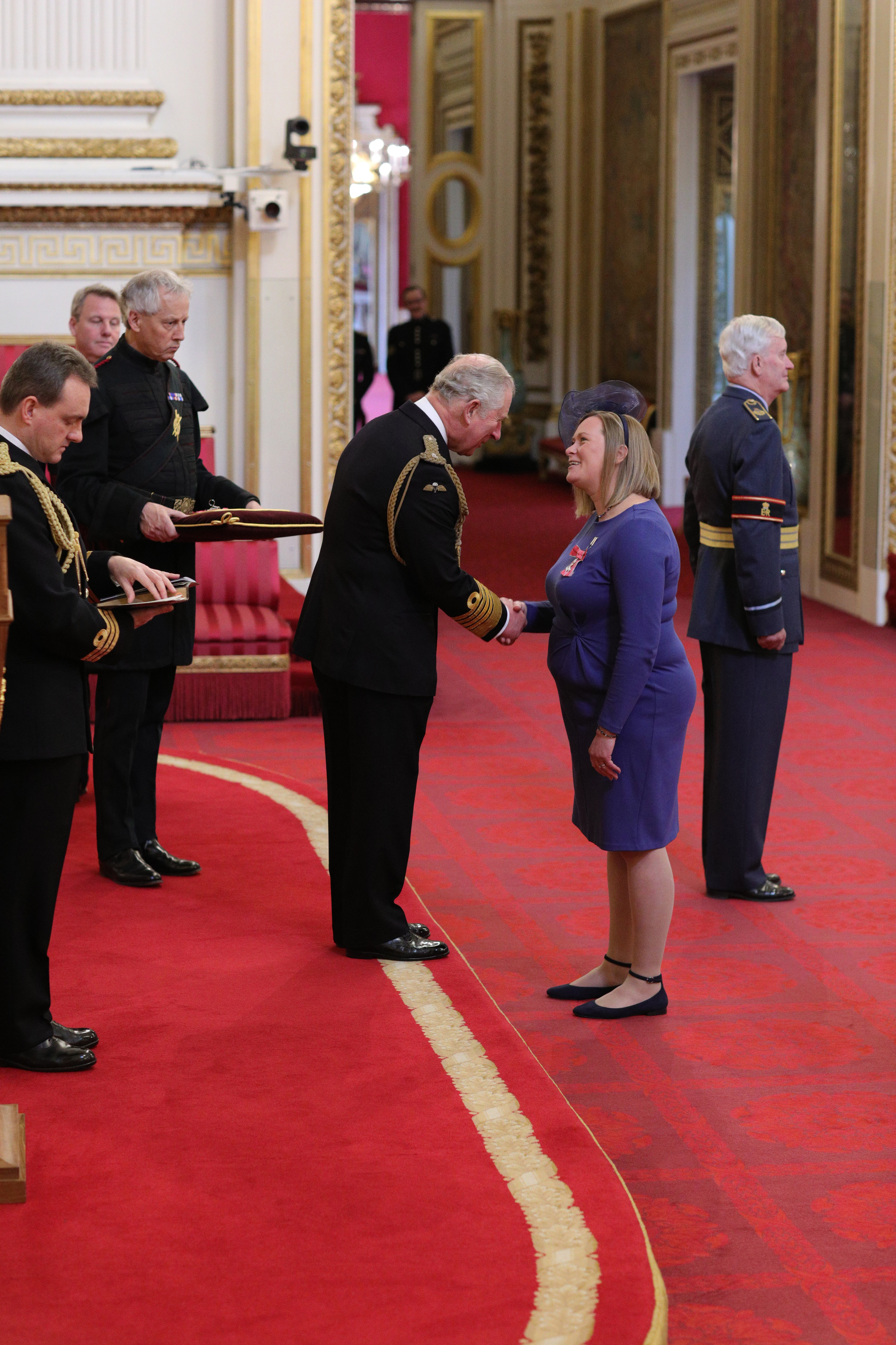 Rebecca Chester receiving her MBE from HRH the Prince of Wales at Buckingham Palace