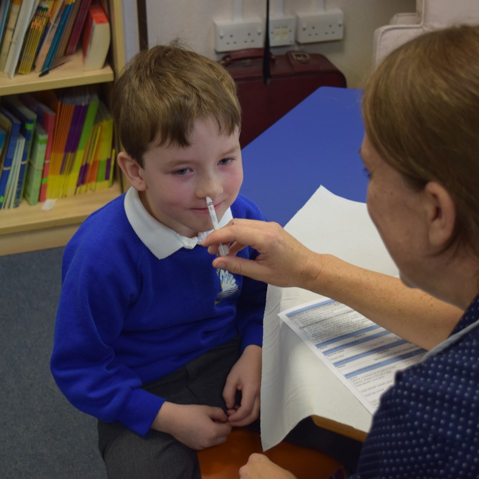 Child receiving flu vaccine