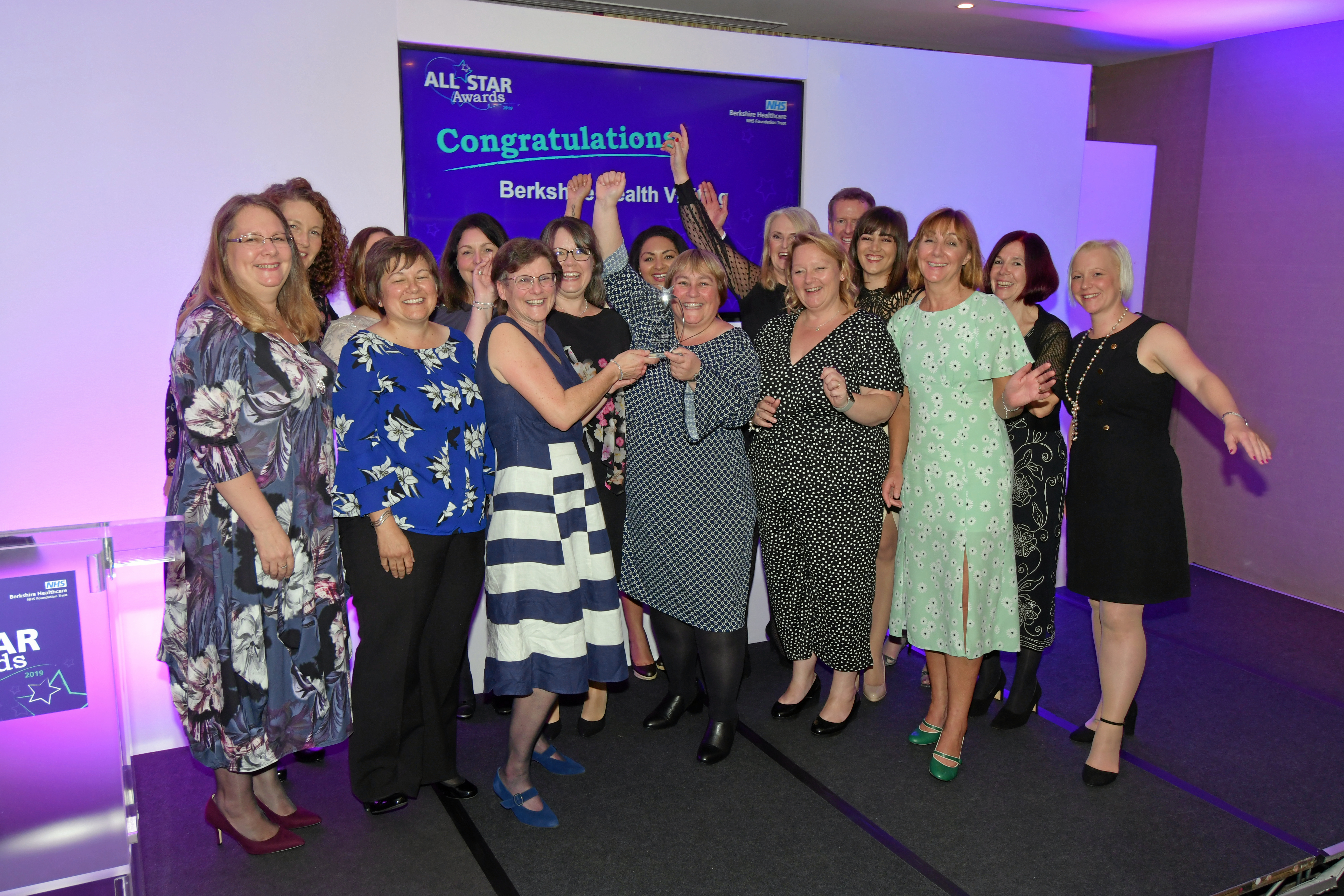 Linda shares the celebration with our health visiting team