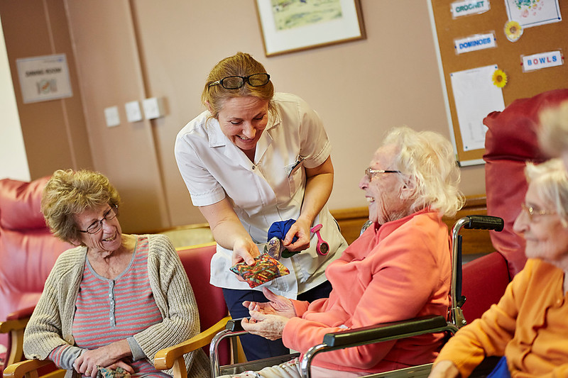 One of our staff members talking to two people