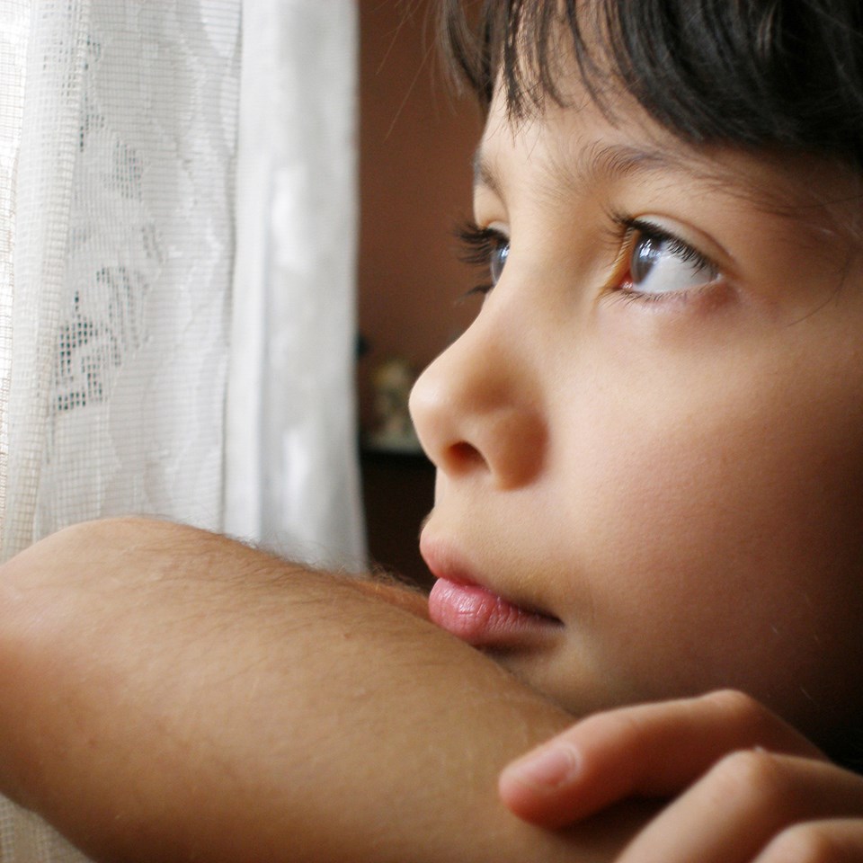 Child looking out of window